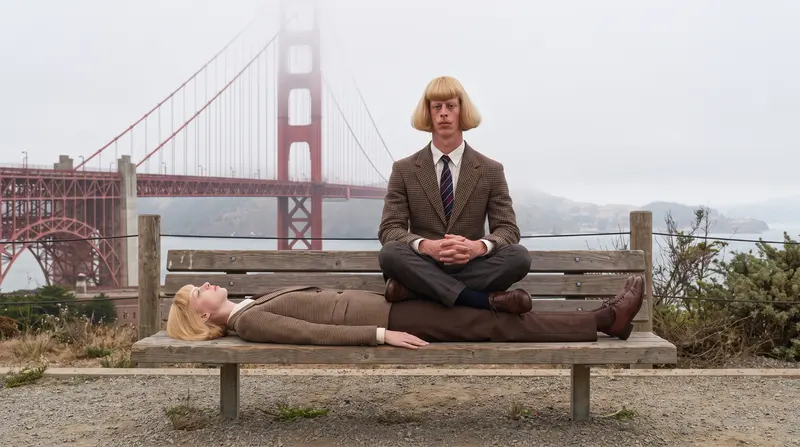 Julie meditating on a bench by the Golden Gate Bridge while Jean naps